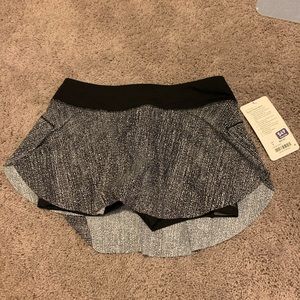 Lululemon quick pace skirt with tags. Size 8.